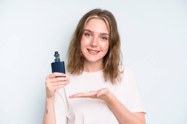 caucasian pretty woman smiling cheerfully, feeling happy and showing a concept. smoker with a vaper concept