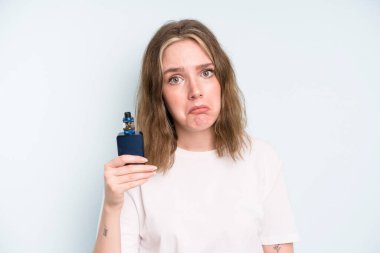 caucasian pretty woman feeling sad and whiney with an unhappy look and crying. smoker with a vaper concept