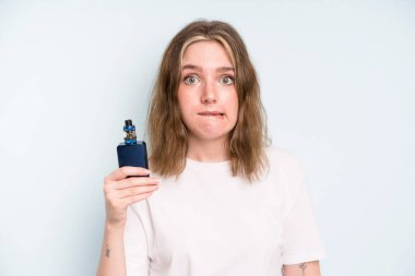 caucasian pretty woman looking puzzled and confused. smoker with a vaper concept