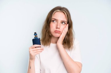 caucasian pretty woman feeling bored, frustrated and sleepy after a tiresome. smoker with a vaper concept