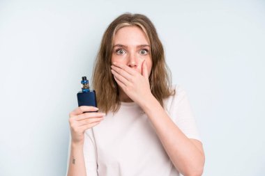 caucasian pretty woman covering mouth with hands with a shocked. smoker with a vaper concept