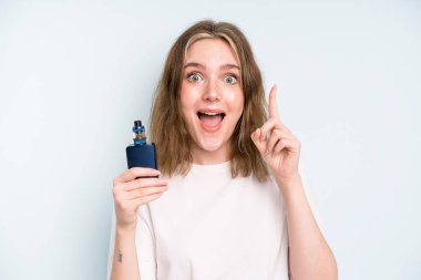 caucasian pretty woman feeling like a happy and excited genius after realizing an idea. smoker with a vaper concept