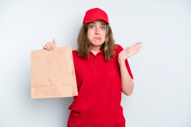 caucasian pretty woman feeling puzzled and confused and doubting. delivery and take away concept