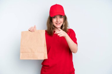 caucasian pretty woman pointing at camera choosing you. delivery and take away concept