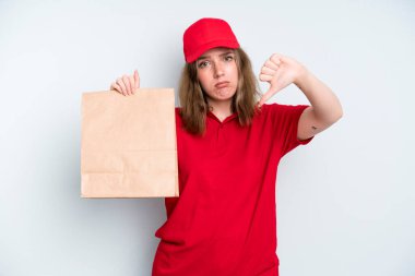 caucasian pretty woman feeling cross,showing thumbs down. delivery and take away concept