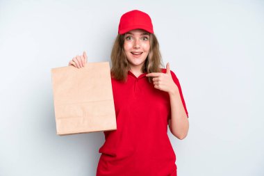 caucasian pretty woman feeling happy and pointing to self with an excited. delivery and take away concept
