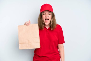 caucasian pretty woman shouting aggressively, looking very angry. delivery and take away concept