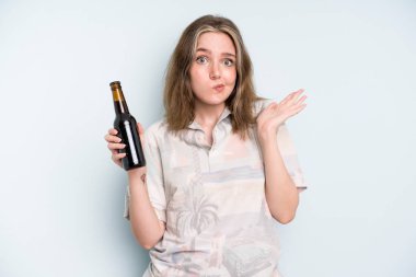 caucasian pretty woman feeling puzzled and confused and doubting. beer concept