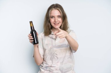 caucasian pretty woman pointing at camera choosing you. beer concept