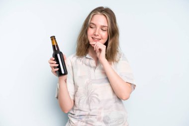 caucasian pretty woman smiling with a happy, confident expression with hand on chin. beer concept