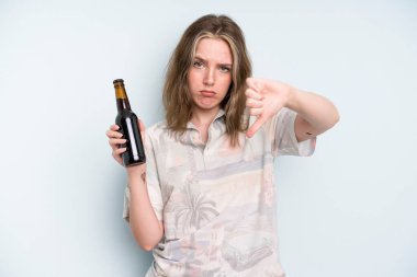 caucasian pretty woman feeling cross,showing thumbs down. beer concept