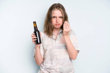 caucasian pretty woman making capice or money gesture, telling you to pay. beer concept