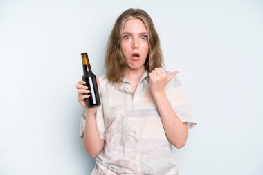 caucasian pretty woman looking astonished in disbelief. beer concept