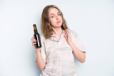 caucasian pretty woman looking arrogant, successful, positive and proud. beer concept