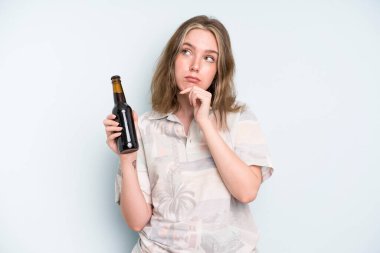 caucasian pretty woman thinking, feeling doubtful and confused. beer concept