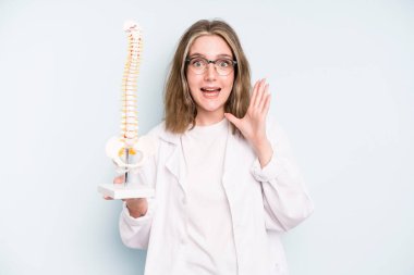caucasian pretty woman feeling happy and astonished at something unbelievable. spine specialist concept