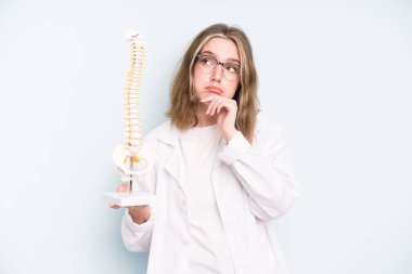 caucasian pretty woman thinking, feeling doubtful and confused. spine specialist concept