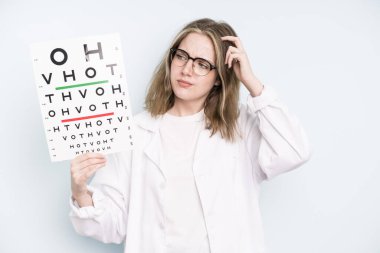 caucasian pretty woman smiling happily with a hand on hip and confident. optical vision test concept