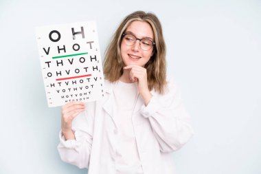 caucasian pretty woman pointing at camera choosing you. optical vision test concept