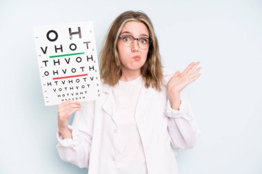 caucasian pretty woman feeling puzzled and confused, scratching head. optical vision test concept