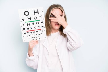 caucasian pretty woman feeling happy and pointing to self with an excited. optical vision test concept