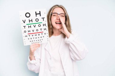 caucasian pretty woman with cheerful and rebellious attitude, joking and sticking tongue out. optical vision test concept