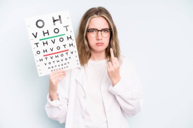 caucasian pretty woman shrugging, feeling confused and uncertain. optical vision test concept