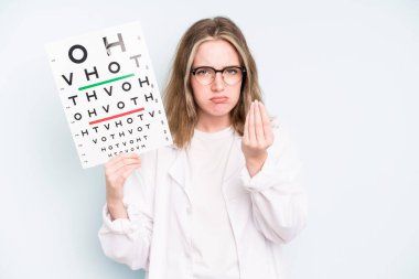 caucasian pretty woman on profile view thinking, imagining or daydreaming. optical vision test concept