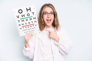 caucasian pretty woman looking arrogant, successful, positive and proud. optical vision test concept