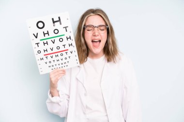 caucasian pretty woman looking astonished in disbelief. optical vision test concept