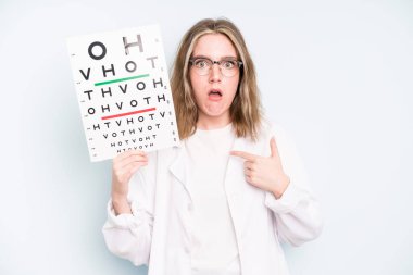 caucasian pretty woman looking unhappy and stressed, suicide gesture making gun sign. optical vision test concept