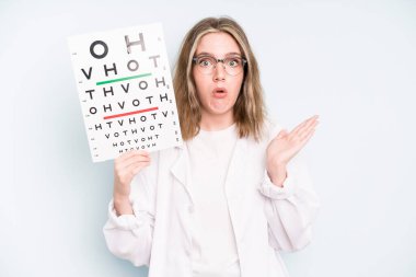 caucasian pretty woman looking puzzled and confused. optical vision test concept