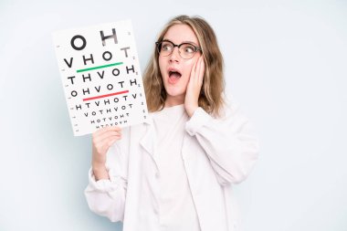 caucasian pretty woman thinking, feeling doubtful and confused. optical vision test concept