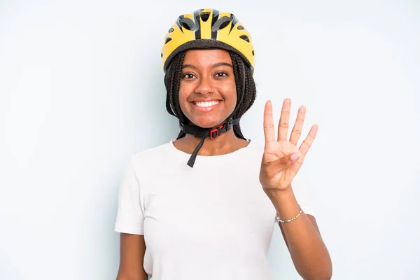 Black Pretty Woman Smiling Looking Friendly Showing Number Four Bike — Stockfoto