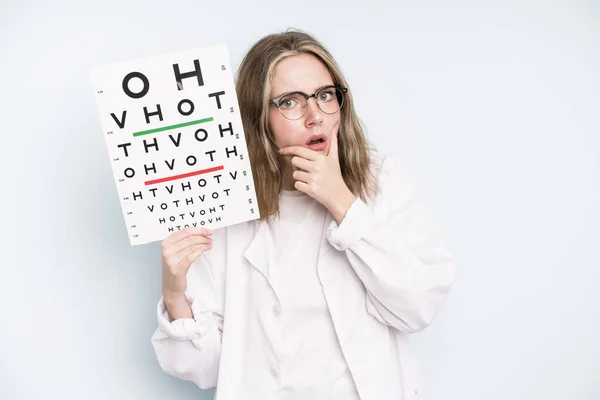 Caucasian Pretty Woman Covering Mouth Hands Shocked Optical Vision Test — Stockfoto