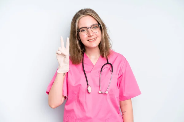 Caucasian Pretty Woman Smiling Looking Friendly Showing Number One Nurse — Fotografia de Stock