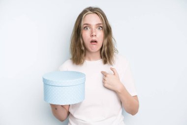 caucasian pretty woman looking unhappy and stressed, suicide gesture making gun sign. gift box concept