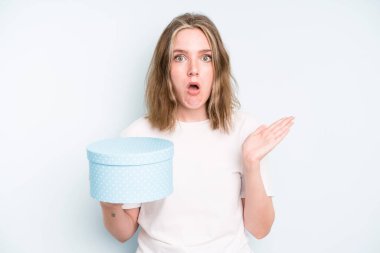 caucasian pretty woman looking puzzled and confused. gift box concept