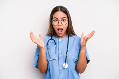 hispanic pretty woman feeling happy and astonished at something unbelievable. medicine student concept