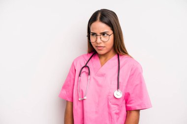 hispanic pretty woman feeling sad, upset or angry and looking to the side. medicine student concept