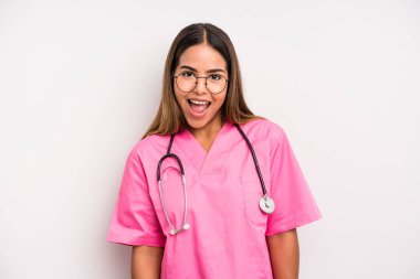 hispanic pretty woman looking happy and pleasantly surprised. medicine student concept