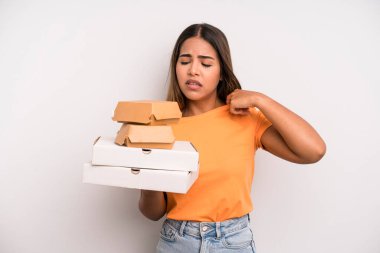 hispanic pretty woman feeling stressed, anxious, tired and frustrated. fast food and take away concept