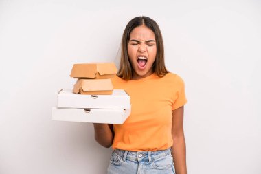 hispanic pretty woman shouting aggressively, looking very angry. fast food and take away concept