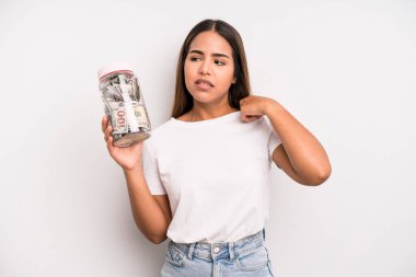hispanic pretty woman feeling stressed, anxious, tired and frustrated. dollar banknotes savings concept