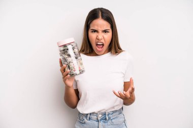 hispanic pretty woman looking angry, annoyed and frustrated. dollar banknotes savings concept
