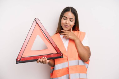 hispanic pretty woman smiling with a happy, confident expression with hand on chin. car accident emergency concept