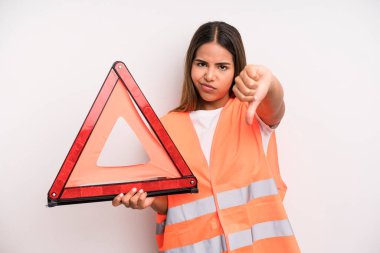 hispanic pretty woman feeling cross,showing thumbs down. car accident emergency concept