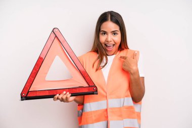 hispanic pretty woman feeling happy and pointing to self with an excited. car accident emergency concept