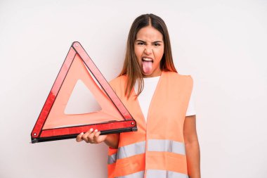 hispanic pretty woman with cheerful and rebellious attitude, joking and sticking tongue out. car accident emergency concept