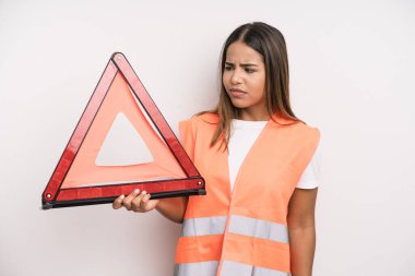 hispanic pretty woman feeling sad, upset or angry and looking to the side. car accident emergency concept